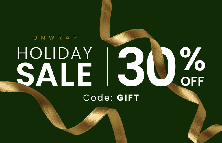 Promotional banner. Text reads "Unwrap. HOLIDAY SALE 30% OFF. CODE: GIFT" 