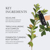 Key skincare ingredients listed are squalane for fast-absorbing hydration, triple hyaluronic acid complex for a soft skin barrier, and fermented turmeric root extract to reduce redness and irritation, shown with a black product bottle and green plant.
