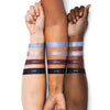 Three arms displaying swatches of four eyeshadow shades labeled Celestial, Stardust, Nebula, and Dusk, showcasing the color variations on different skin tones.