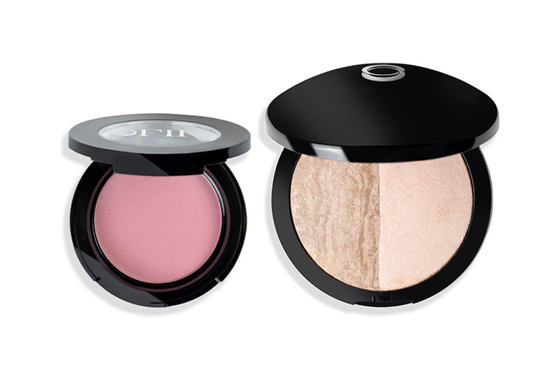 Two black compacts with makeup products; one contains a soft pink blush and the other features a dual-toned highlighter with beige and ivory shades.