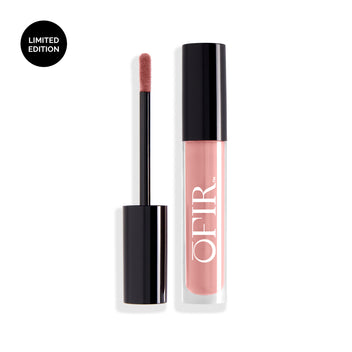 A limited edition soft pink liquid lipstick with a black applicator and sleek packaging.