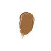 A smear of smooth, creamy brown makeup product on a white background.