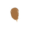 A swatch of smooth, creamy brown makeup product with a glossy finish on a white background.