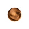 A smooth, glossy swirl of rich caramel-colored cream with soft highlights and subtle marbling.