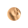 A smooth, beige circular cream swatch with a glossy finish against a white background.