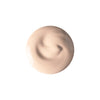 A smooth, creamy, beige cosmetic product in a circular shape on a white background.