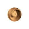 A swirl of creamy, light brown liquid with a smooth texture, likely representing a cosmetic product.