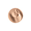 A smooth, beige circular dab of creamy liquid with a glossy sheen, suggesting a cosmetic product like foundation or concealer.