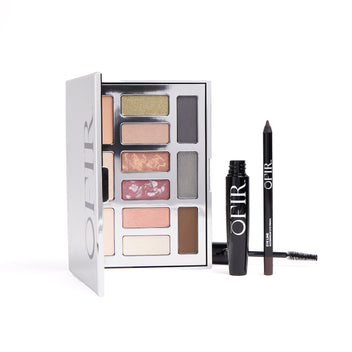 A makeup set featuring a palette with a variety of eyeshadow colors, a black mascara, and an eyeliner pencil, all branded with "OFIR".