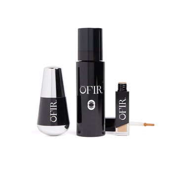 Three elegant black cosmetic containers are displayed: a rounded bottle with a metallic cap, a tall cylindrical bottle, and a small rectangular bottle with an applicator wand.