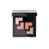 Black makeup palette featuring four shimmery eyeshadows in shades of peach, pink, orange, and bronze arranged in a geometric pattern.